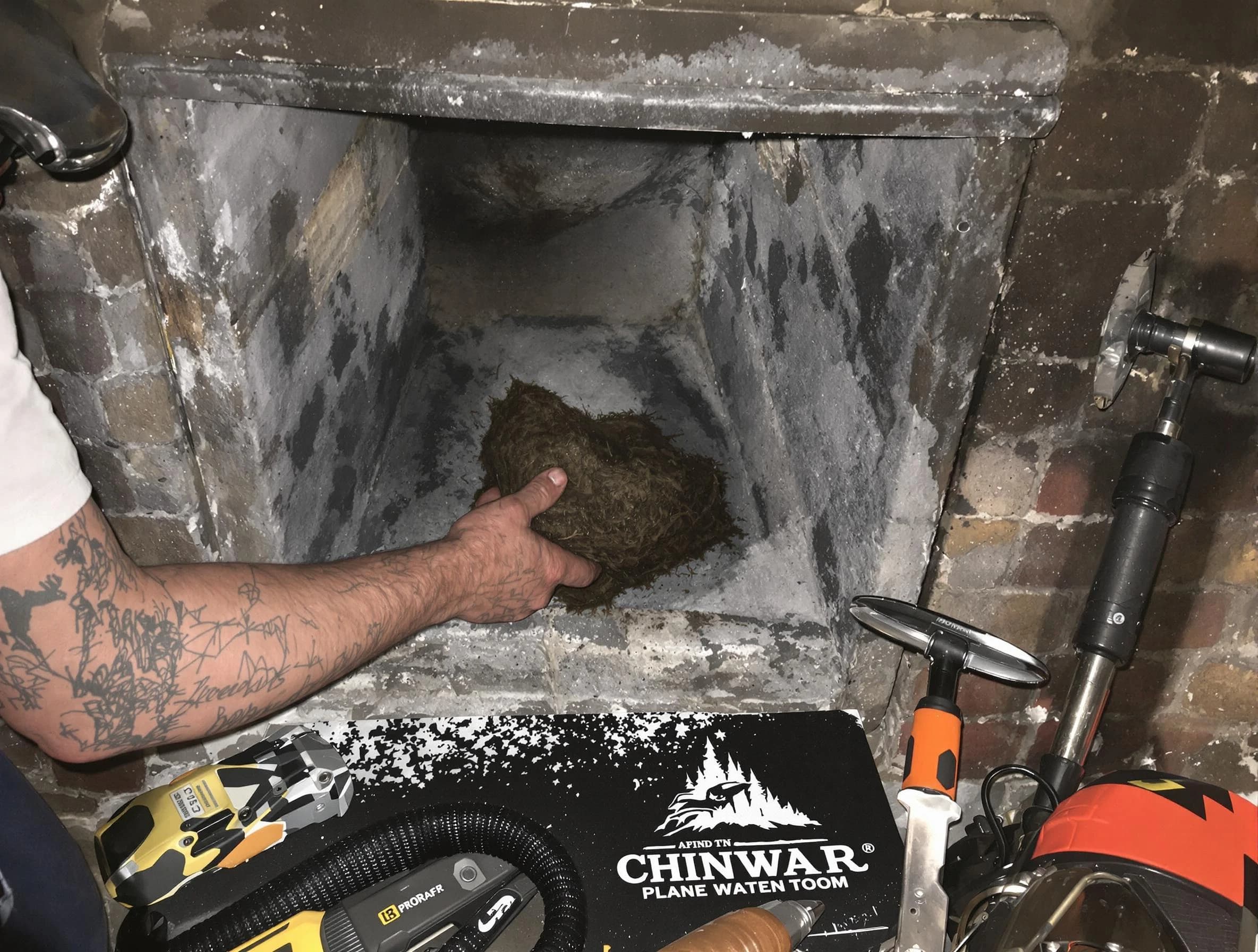 Saugus Chimney Sweep safely removing debris and screening chimney in Saugus, MA